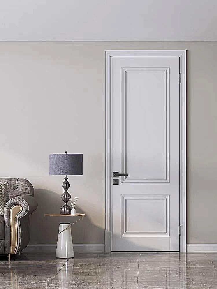 White-painted ecological door with a classic panel design, complementing a modern interior with elegant decor.