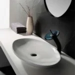 Sanitary Ware 23 Contemporary white vessel sink with black drain and sleek modern faucet design